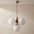 Suspension 4 globes opalin blanc laiton brossé design moderne IP40