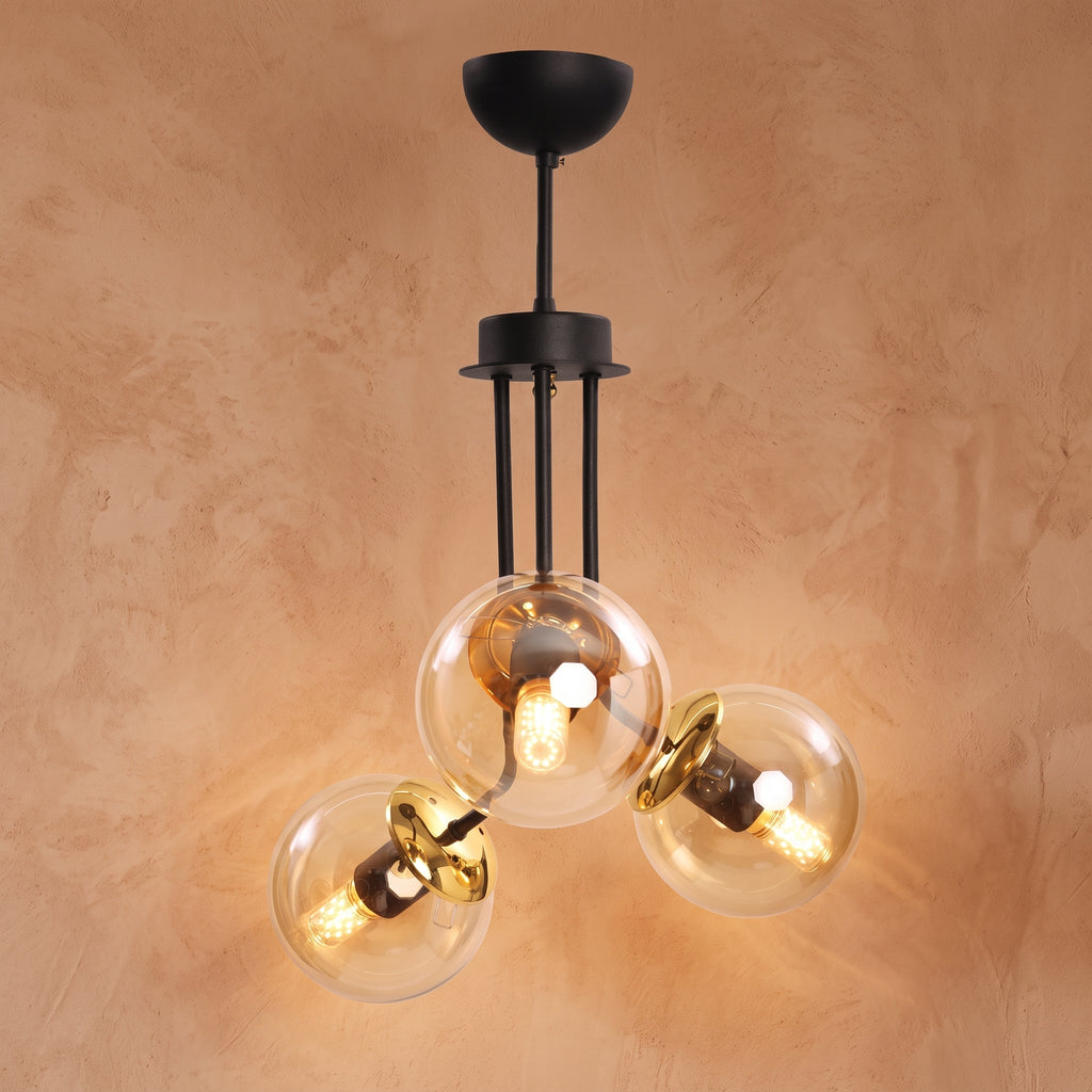 Lustre 3 globes ambrés structure noire détails dorés design moderne IP40