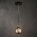 Lustre suspendu globe fumé noir et doré design élégant