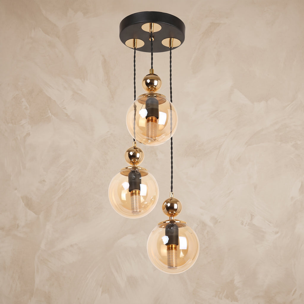Suspension cascade 3 globes ambré noir mat et doré design moderne