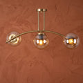 Plafonnier 3 globes ambrés finition laiton doré design moderne IP40