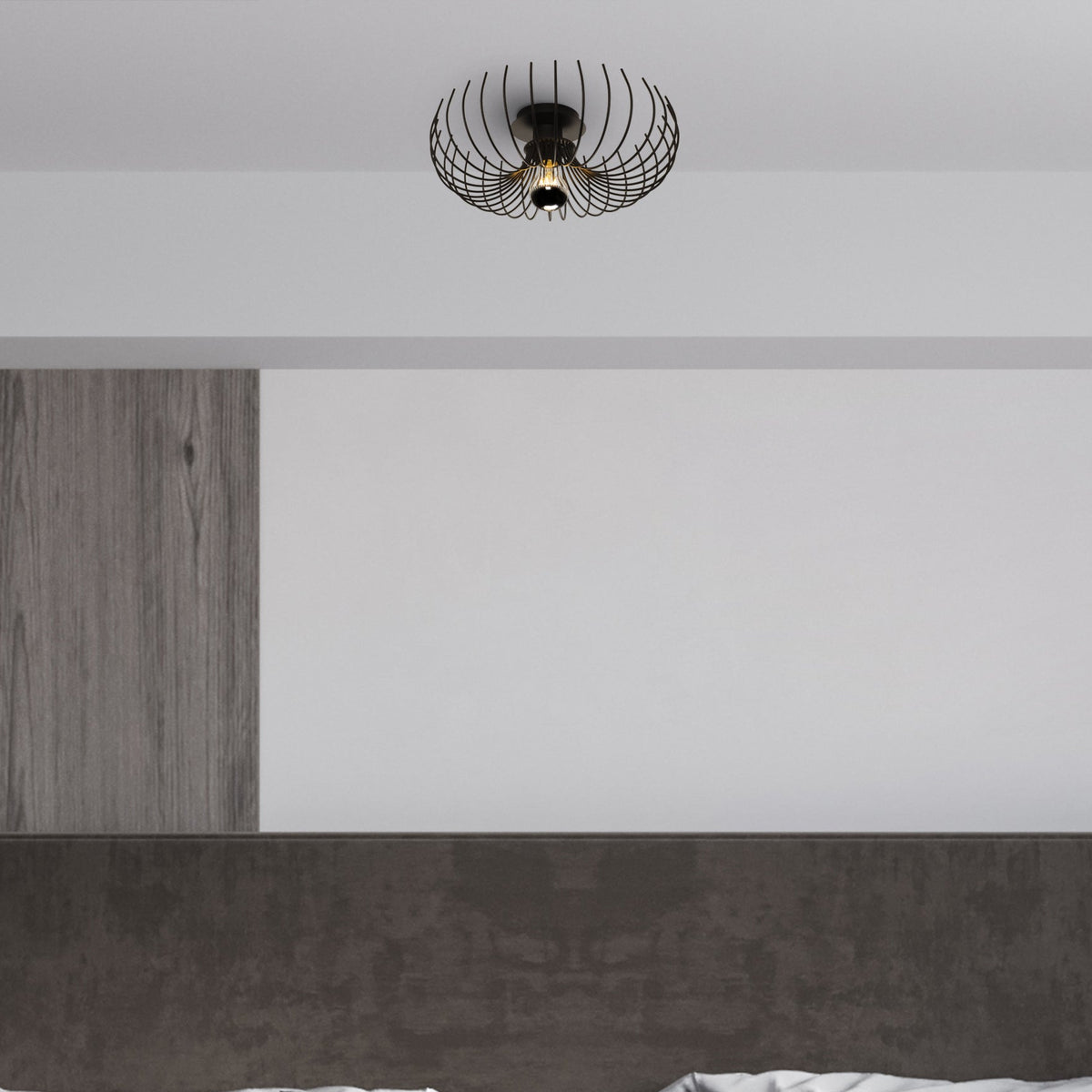 Plafonnier cage spirale noir installé au plafond d’une chambre moderne