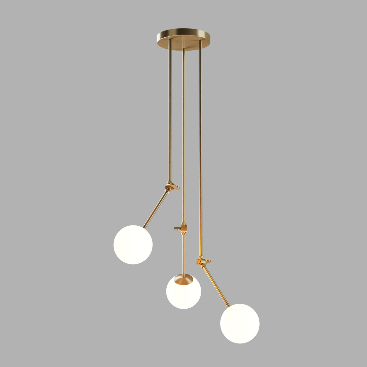 Vue de la suspension 3 globes blanc opale avec structure dorée et bras articulés